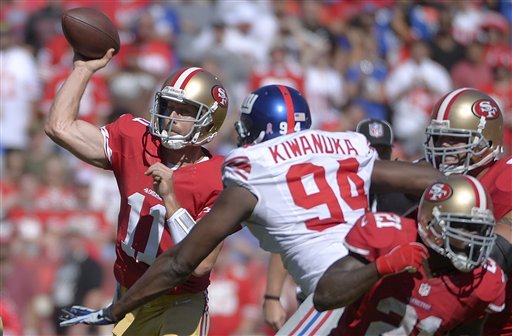Alex Smith hurried by Mathias Kiwanuka