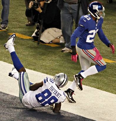 Dez Bryant unable to stay in bounds when he falls down as his right hand touched the the line